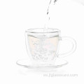 Taza de té de cristal popular con platillo